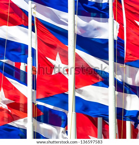 Compact group of cuban flags useful to illustrate subjects related to the cuban revolution, politics or communism