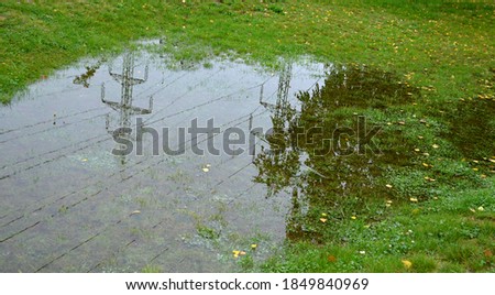 too compact and impermeable soil does not absorb water during rains and floods. a lake was created in the park in the lawn, which gradually infiltrates. damage to the lawn long flooding.  water push