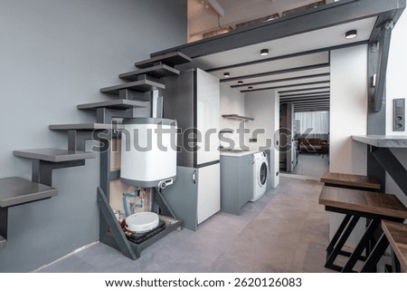 A compact and modern loft interior featuring space-saving elements, sleek furnishings, open layout, and smart storage solutions, showcasing contemporary design with functionality and aesthetic appeal
