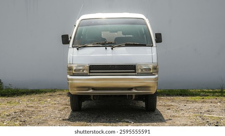 A compact silver van with a boxy design, rugged appeal, and practical utility. Perfect for urban transport, business, or adventure-ready road trips.