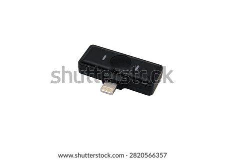 Compact wireless microphone receiver with a Lightning connector for smartphone audio and video recording, isolated on a white background.