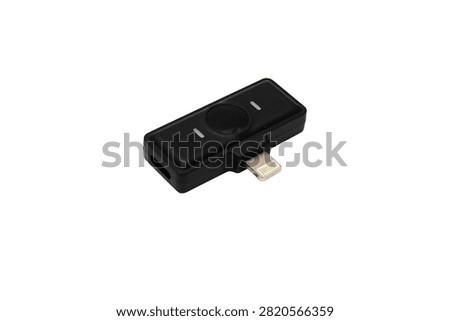 Compact wireless microphone receiver with a Lightning connector for smartphone audio and video recording, isolated on a white background.
