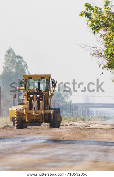 Compaction machinery for rail road
construction in Chiang Mai, Thailand.
Grader is working on a road
construction site to smooth the
ground.