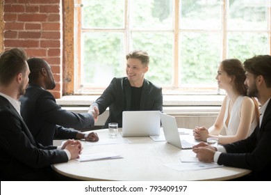 Company Boss Handshaking Happy African Employee, Friendly Ceo Welcoming Greeting Promoting Congratulating Black Businessman Joining Team At Group Meeting, Executive And New Hire Member Shaking Hands