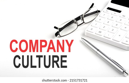 COMPANY CULTURE Concept. Calculator,pen and glasses on a white background