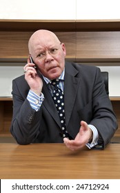 A Company Director Engaged In Tense Negotiations During A Mobile Telephone Conversation