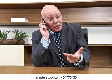 A Company Director Engaged In Tense Negotiations During A Mobile Telephone Conversation