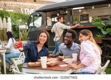 Company of diverse friends taking selfie near food truck - Powered by Shutterstock