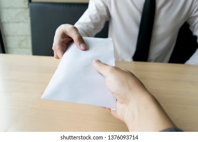 Company employees have been corrupt by bringing money to the company's human resources department. To allow him to be promoted to manager - Shutterstock ID 1376093714
