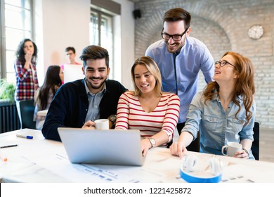 Company employees working in office - Shutterstock ID 1221425872