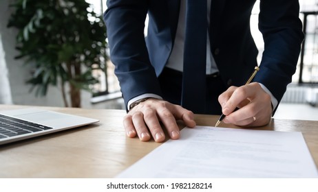 Company executive, business owner, employer signing contract, agreement, paper report at workplace. Businessman affixing signature, hiring employee, buying or selling project, closing deal. Close up - Shutterstock ID 1982128214
