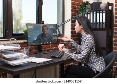 Company Office Worker In Virtual Remote Video Conference With Accounting Manager Talking About Business Plan. Asian Team Leader In Internet Online Call Conversation With Agency African American