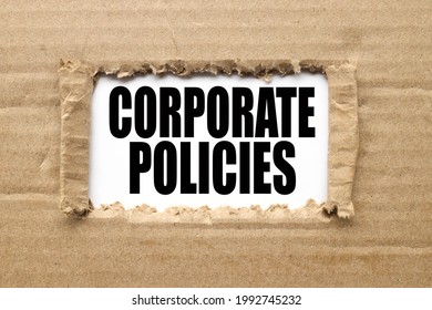 Company Policy. Text On Torn Cardboard. Black Letters On White Paper