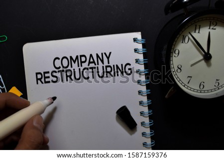 Company Restructuring write on book isolated on office desk.