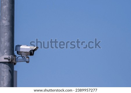 a company surveillance camera in blue sky