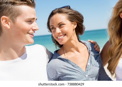 Company of young people on the beach - Shutterstock ID 738880429