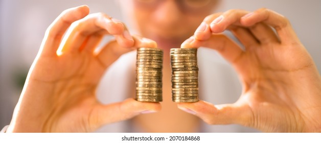 Compare Wage Gap, Money Pay And Equal Salary - Shutterstock ID 2070184868