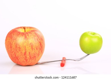 Comparing Big Apple  To Small Apple  On A Balance Beam Isolated On White  Big Apple And Small Apple