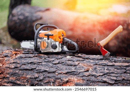 Comparison of chainsaw and axe in industrial logging.