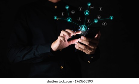 Comparison Of Mass Marketing Concept.network Specific Groups Concept.Closeup Of Hands Social Networking With Mobile.