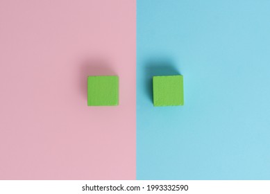 Comparison of Two Objects Blocks Pencils Sticker Notes Facing Inward Outward Making An Arrangement Reflection On a Separated Coloured Background Shot In A Flat Lay Perspective