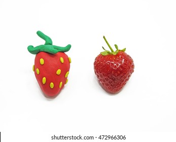 Comparison of two strawberries - Real and Fake. - Shutterstock ID 472966306