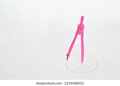 A compass as a drawing tool for drawing circles or arcs. It is also used to accurately measure distances, particularly on maps. - Powered by Shutterstock