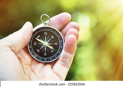 Compass in the hand - Shutterstock ID 225823546