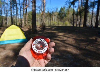 Compass in hand. A navigation tool for off-road orientation.