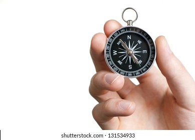 compass in hand on a white background close-up - Powered by Shutterstock
