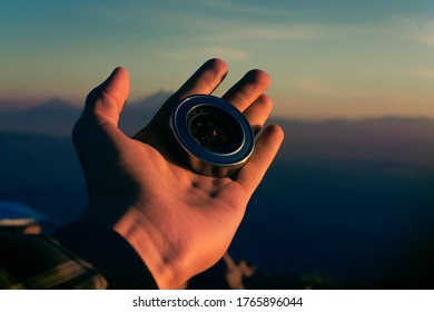 compass in the hands of a man