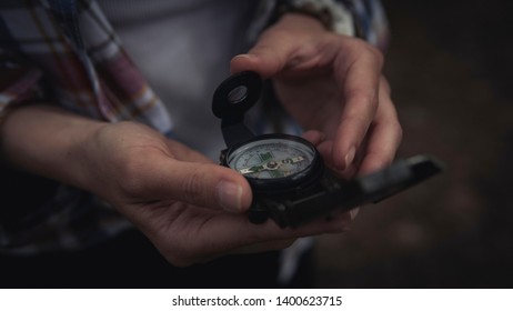 Compass in the hands of a young girl - Shutterstock ID 1400623715
