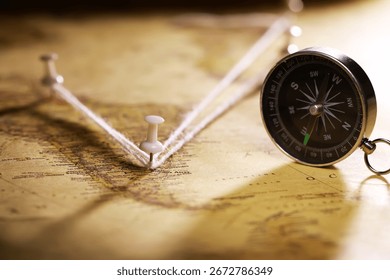 Compass and Map with Push Pins Symbolizing Travel Planning and Exploration