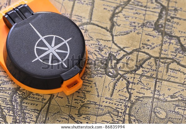 Compass and\
old map. Processing of a antique\
photo