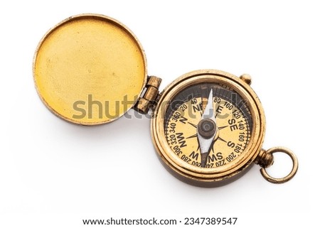 Compass old vintage brass nautical compass isolated on white background