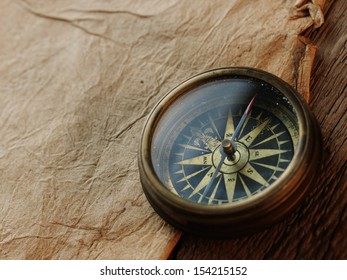 compass on the background of an old paper - Shutterstock ID 154215152