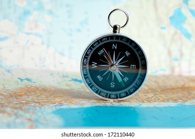 compass on the map on the area of confusion - Shutterstock ID 172110440