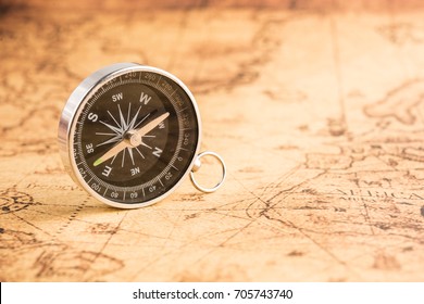 Compass on old map vintage style - Shutterstock ID 705743740