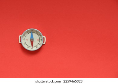 Compass on a red background. Navigational Compass on Red Background. - Shutterstock ID 2259465323