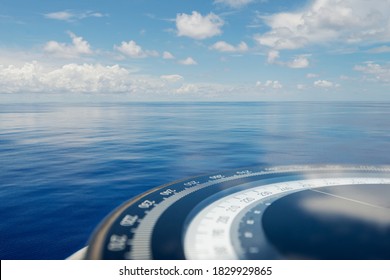 Compass on ship boat blue summer sea ocean day with bright sky. Marine navigation cruise background banner. Shipping industry concept.