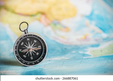 compass on the tourist map. Focus on the compass needle - Shutterstock ID 266887061
