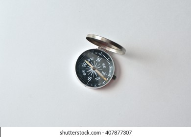 Compass on a white background. Photo of magnetic compass on white paper. - Shutterstock ID 407877307