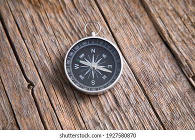 compass on the wooden table background