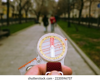 A Compass In A Person's Hand. Orient Yourself In The Current Situation (urban Conditions). Follow The Innner Compass, Intuition Concept, Public Sentiments