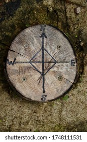 Compass Points Drawn On A Piece Of Cut Wood