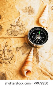 Compass and shells on old marine map - Shutterstock ID 79979230