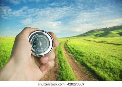 compass in way in blue sky - Shutterstock ID 428298589
