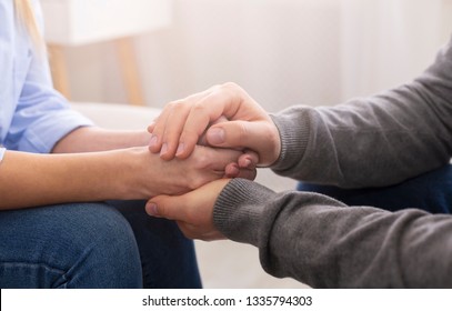 Compassion And Concern Concept. Psychiatrist Supporting His Patient Hands During Therapy