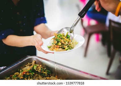 Compassion in human society leads to free food donations to the poor: poor people still need food, concept of feeding to the poor - Shutterstock ID 1539777818