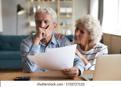 Compassionate elderly woman supporting upset stressed mature husband, received bad news banking letter. Unhappy depressed family married couple having financial trouble, got house eviction notice.